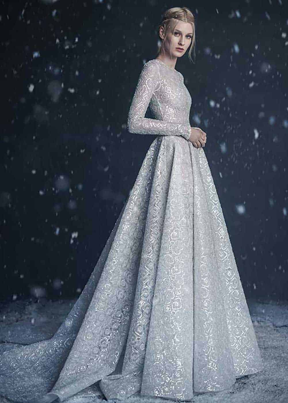 Paolo Sebastian platinum full skirted ball gown with sleeves and pockets, full-beaded lace embellishment and train from his 2016 autumn/winter couture collection. 