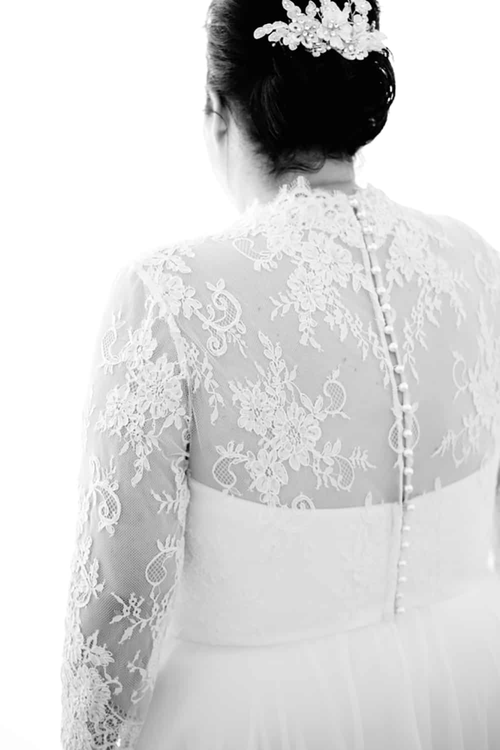 We love the sheer lace back on this wedding dress worn by plus-size bride Amanda.