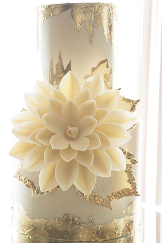 gold foil and white flower wedding cake