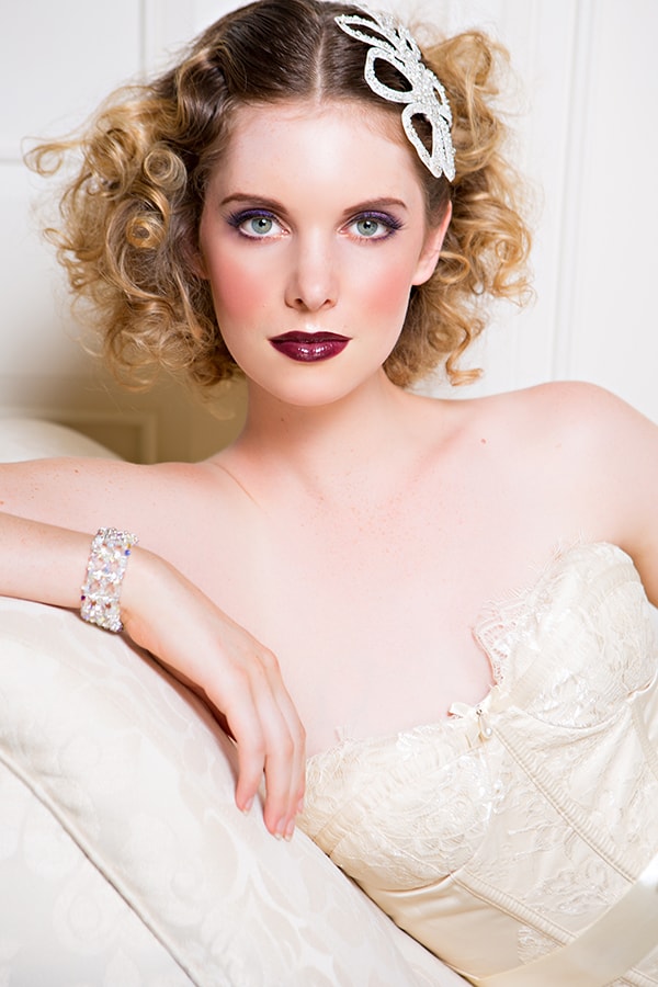 Curls with white beaded headpiece.