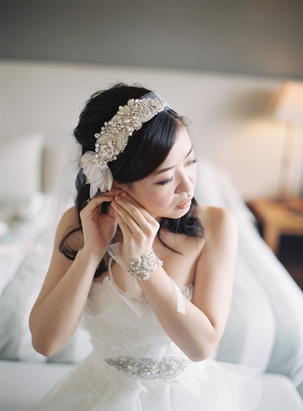 Bride Ivette getting ready for her wedding wearing beaded headpiece.