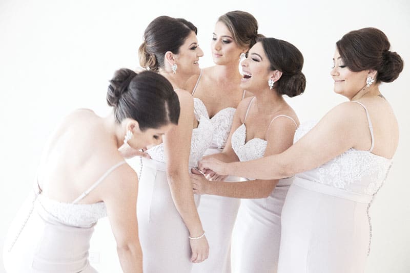 Bridesmaids getting ready together.