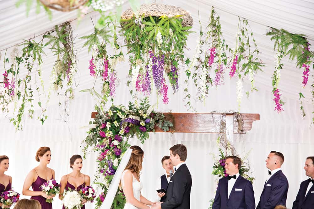 Overhanging florals for this wedding ceremony.