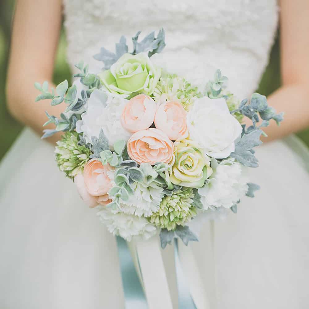 Peach, green and white floral bouquet with succulents