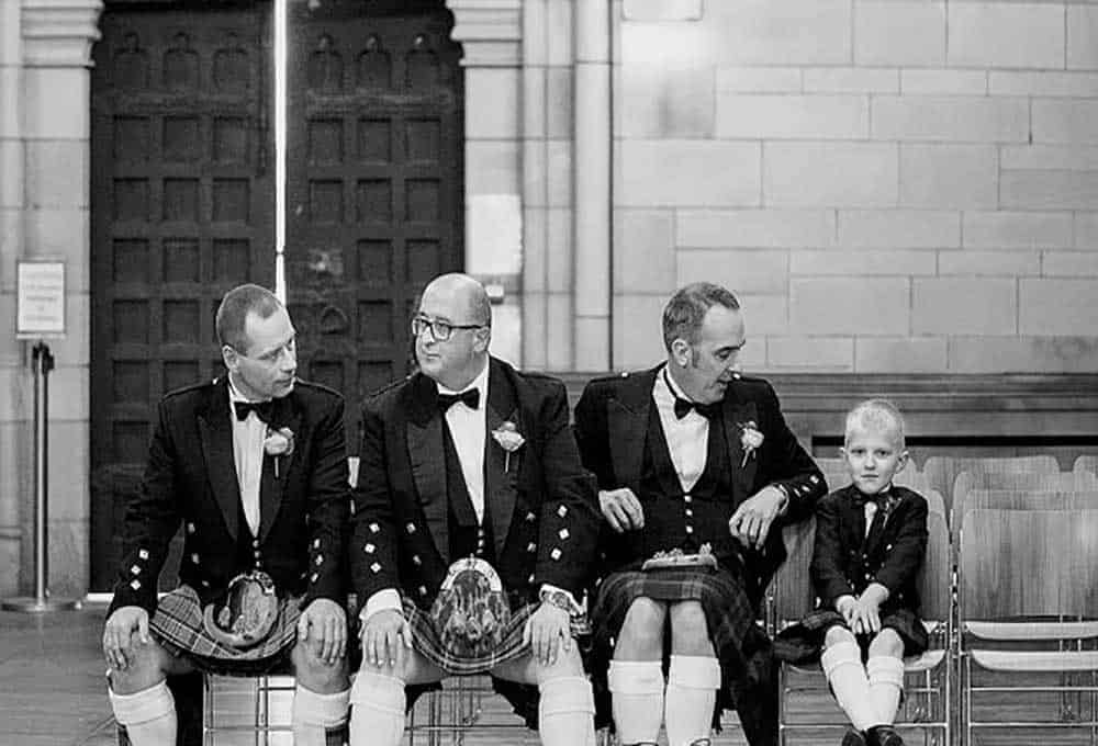 Groom and groomsmen in traditional Scottish kilts photographed by Christopher Thomas Photography.