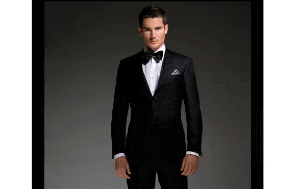 Groom style: black tuxedo and bow tie.