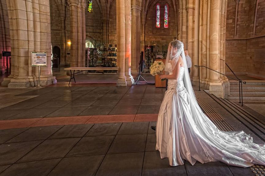 bride walking into church by Christopher Thomas Photography