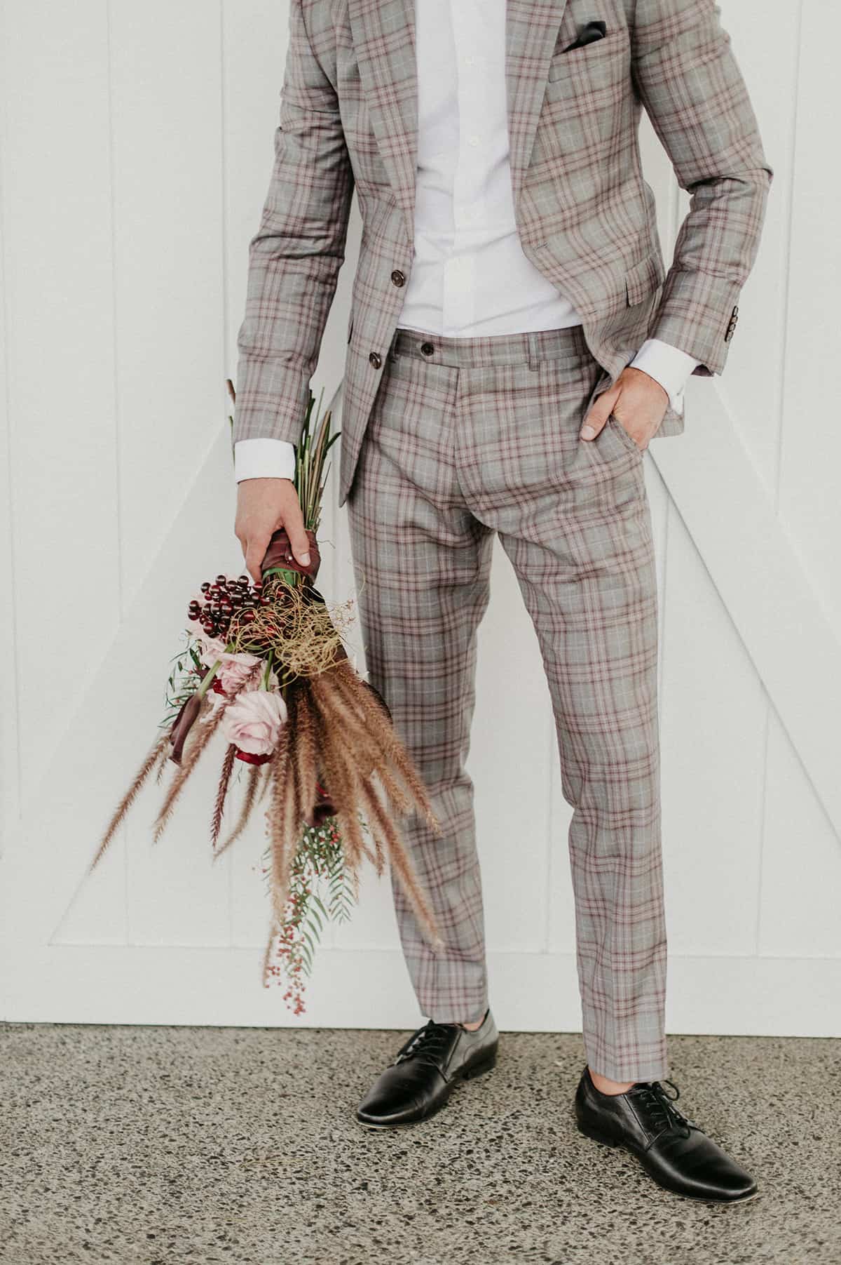 groom with bouquet