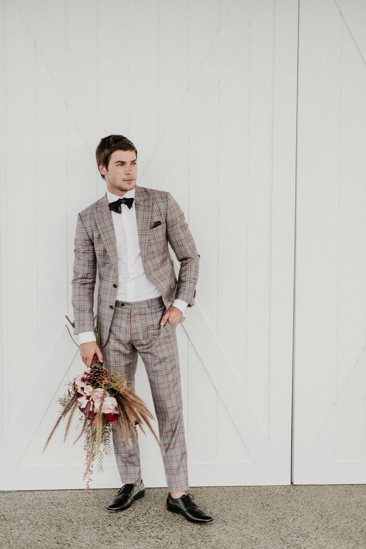 groom in plaid suit