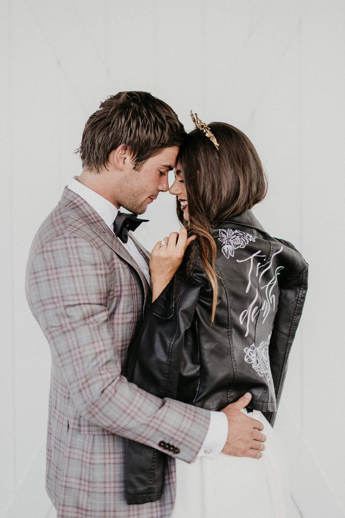 bride and groom with leather jacket
