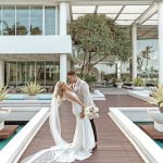 Sheraton-Gold-Coast-Weddings-newlywed-newlyweds-newlywedded-couple-on-a-walkway-by-the-pool