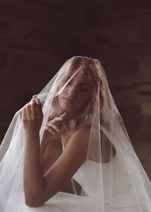 Wedding dress with pearl veil by Erin Clare Bridal