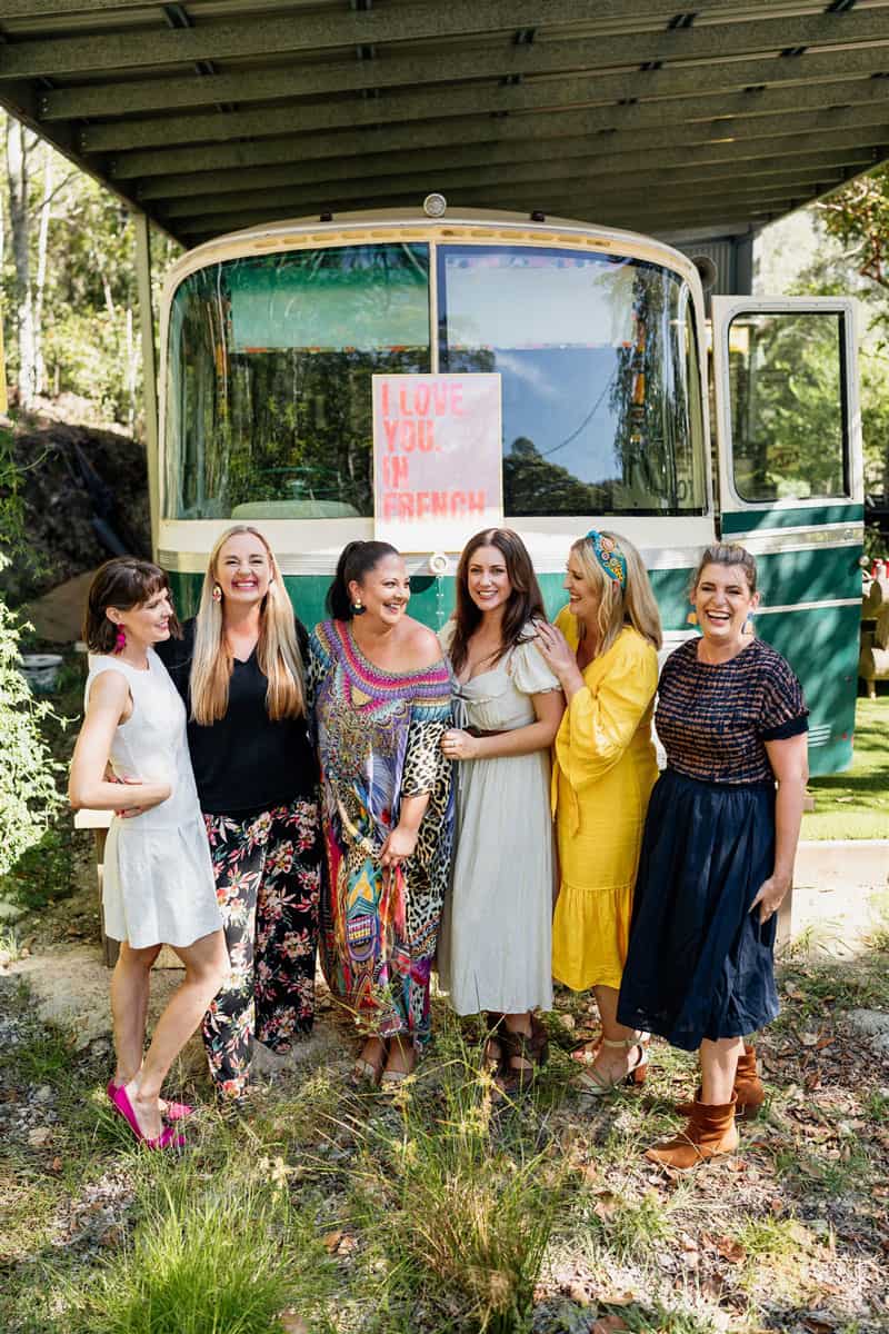 Frequently asked wedding ceremony questions - picture of the celebrants with a vintage bus on the background