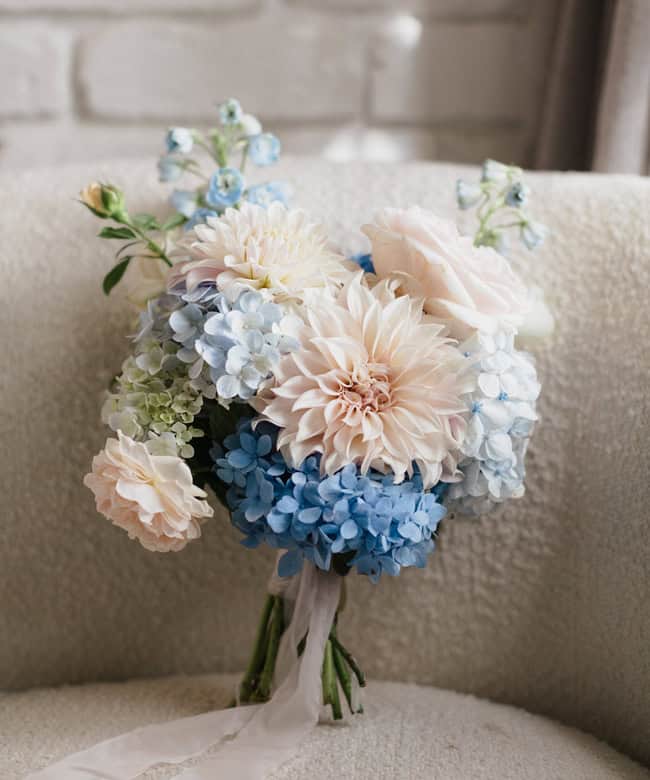 Bring blue to your bouquet styling à la Bud & Willow Floral Design for Lillie & Jayden. Photo: Allumé Wedding Photography at Figtree Restaurant