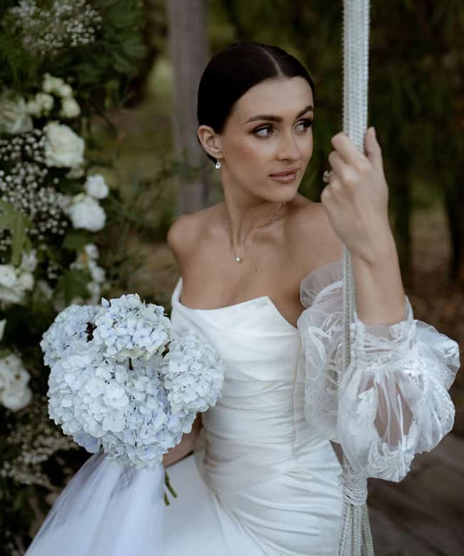 A romantic statement from Bloom & Bush. Gown: Erin Clare Bridal. Photo: White Parrot Wedding Photography & Film. See this exquisite styled shoot in our current QB issue.
